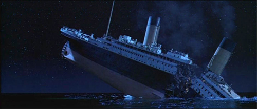 Movie screenshot of the Titanic breaking in half.